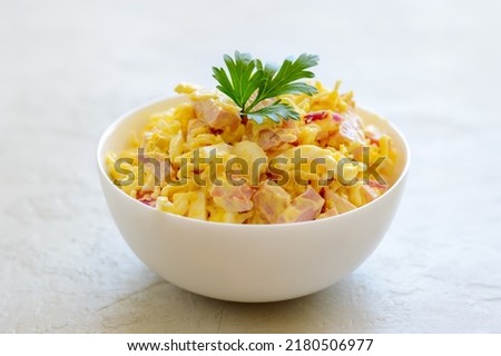 Nutritious salad with instant noodles, eggs, ham and red onion. Royalty-Free Stock Photo #2180506977