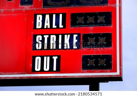 Red baseball scoreboard for keeping track of ball strike out