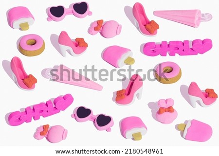 Creative pattern made of pink girls' stuff. Funny big set of girly things. Make up, bag, purse, perfume, heart, heels, sweet donats, sunglasses. Cute Cartoon Design.