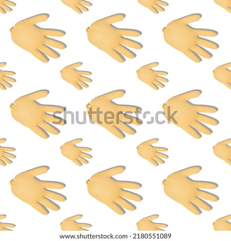 pattern with inflated yellow medical gloves on white background. Prevention and protection of coronavirus, covid-19. Healthcare concept. Abstract background.