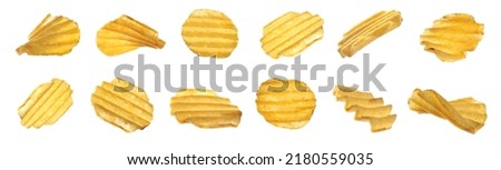 Set of ridged crispy potato chips on white background. Banner design Royalty-Free Stock Photo #2180559035