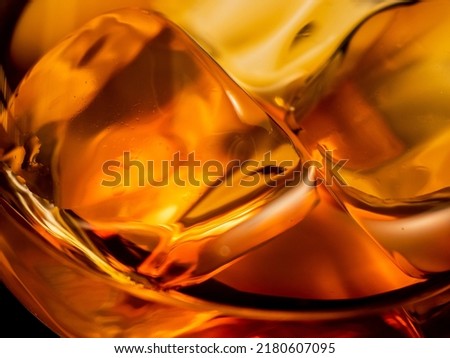 Whisky on the rocks, glass filled with ice cubes, close-up shot Royalty-Free Stock Photo #2180607095
