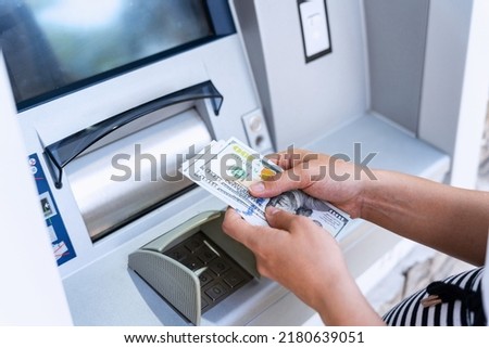 Atm money cash machine. Woman withdraw money bill. Holding american hundred dollar cash. Bank credit card, us dollar Royalty-Free Stock Photo #2180639051
