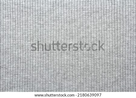 Knitted gray fabric texture, textile background Royalty-Free Stock Photo #2180639097