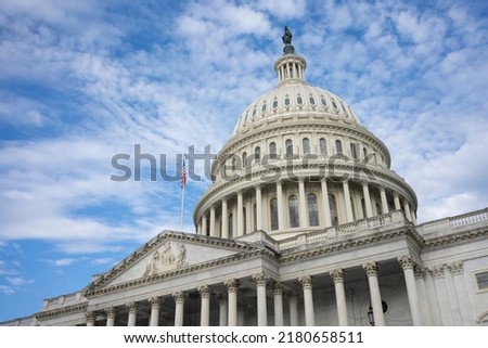 The United States Capitol dome against a clearing sky viewed from the east front of the U.S. Capitol building in Washington, DC. Royalty-Free Stock Photo #2180658511