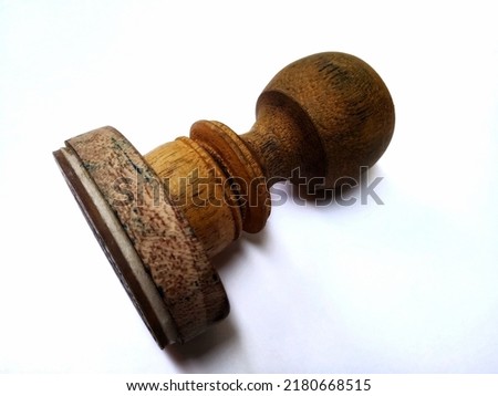 A Wooden Stamp On A White Background


