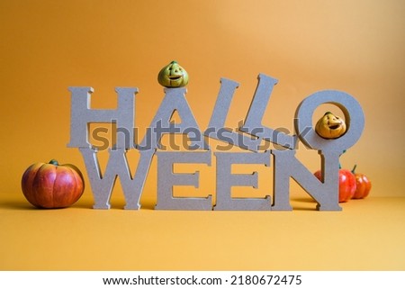 Pictures of Halloween characters and pumpkin and orange background