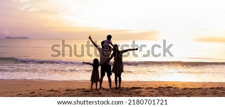 Banner silhouette of happy people in family are holding hand together on the beach with happy moment, concept of love, relation, bonding, togetherness, support, careful, growing, in family life.