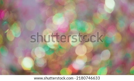 Defocused background of blurred vivid festive golden lights shimmering brightly during holiday celebration