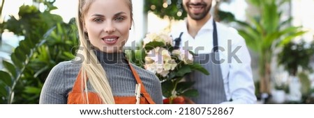 Female flower studio consultant ready to help you with choice Royalty-Free Stock Photo #2180752867