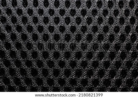mesh fabric in black color background texture closeup