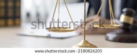 Lawyers or judges sign documents in accordance with legal and fair terms of agreement, Legal Ethics and Integrity, scales of justice, law hammer, Litigation and legal services.