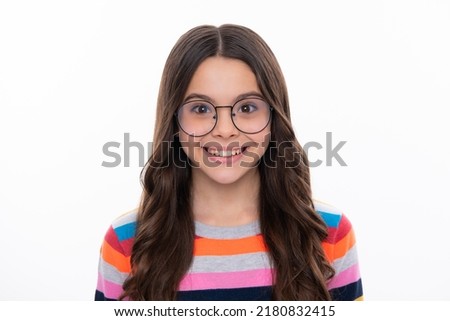 Happy girl face, positive and smiling emotions. Child little girl 12, 13, 14 years old background studio portrait. Childhood lifestyle concept. Close-up portrait of caucasian teenager child. Royalty-Free Stock Photo #2180832415