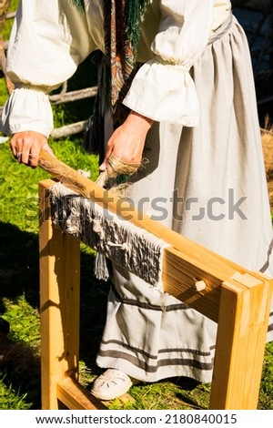 Ancient devices for processing flax lose up Royalty-Free Stock Photo #2180840015