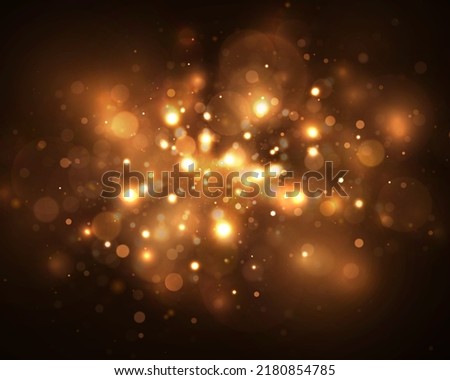 Sparkle bokeh background. Glitter light effect. Bright light particles twinkle on black background. 