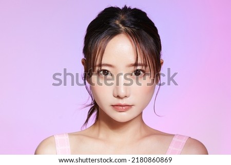 Beauty portrait of young Asian woman on colorful background Royalty-Free Stock Photo #2180860869