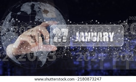 January 27th. Day 27 of month, Calendar date. Hand hold virtual screen card with calendar date.  Winter month, day of the year concept