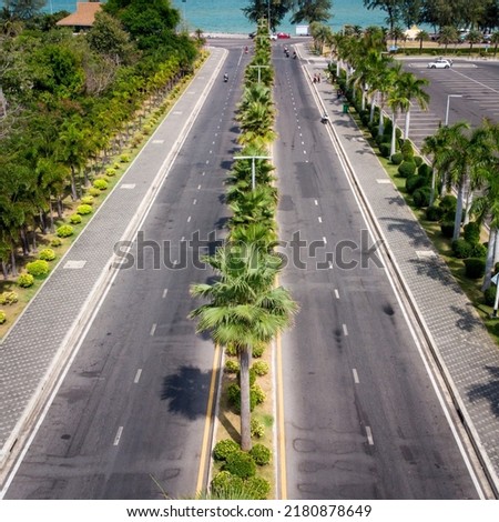 Miami Beach close to chalatat beach at Songkhla park, Thailand.
Beautiful landmark of  Songkhla with coconut plam tree and road path.