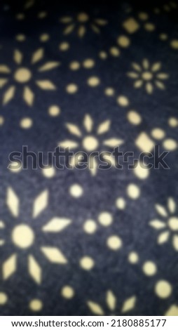 defocused abstract background on navy and white fabric surface