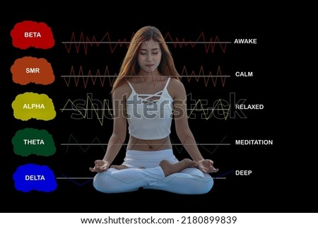 Young meditating woman with brain wave frequencies. Royalty-Free Stock Photo #2180899839