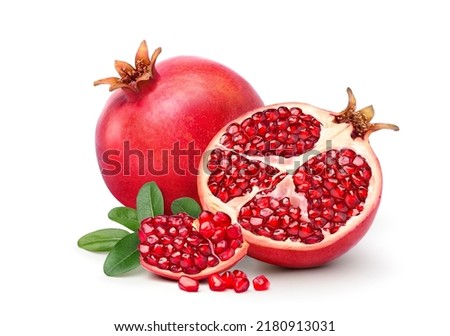 Fresh ripe pomegranate with cut in half isolated on white background. Royalty-Free Stock Photo #2180913031