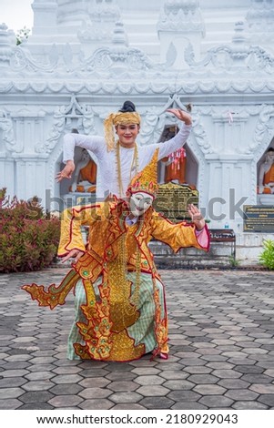 beautiful dress with poses for music, dance, performances, Burmese arts, wearing masks