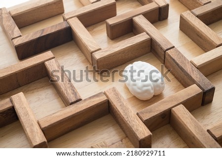 Human brain find search the exit way in wooden maze game background. Business problem solution for successful target, creative thinking new ideas, innovation, knowledge education concept. Royalty-Free Stock Photo #2180929711