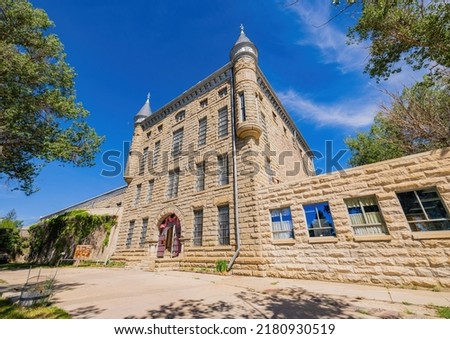 Sunny exterior view of the Wyoming Frontier Prison Museum at Wyoming Royalty-Free Stock Photo #2180930519