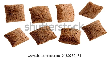 Set of cornflakes chocolate pillows for breakfast. Isolated on white Royalty-Free Stock Photo #2180932471