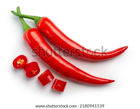 Chili pepper isolated. Chilli top view on white background. Whole and cut red hot chili peppers top. With clipping path. Royalty-Free Stock Photo #2180941539
