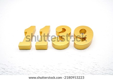   Number 1139 is made of gold painted teak, 1 cm thick, laid on a white painted aerated brick floor, visualized in 3D.                               