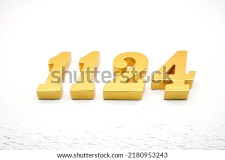   Number 1124 is made of gold painted teak, 1 cm thick, laid on a white painted aerated brick floor, visualized in 3D.                                