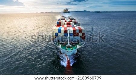 front of Cargo container ship carrying container and running near international custom depot sea port concept smart logistic. Freight forwarding service