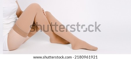 Compression Hosiery. Medical Compression stockings and tights for varicose veins and venouse therapy. Socks for man and women. Clinical compression knits. Comfort maternity tights for pregnant women. Royalty-Free Stock Photo #2180961921