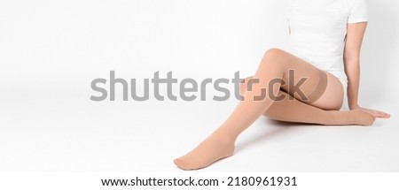 Compression Hosiery. Medical Compression stockings and tights for varicose veins and venouse therapy. Socks for man and women. Clinical compression knits. Comfort maternity tights for pregnant women. Royalty-Free Stock Photo #2180961931