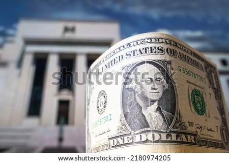 dollars on the background Federal Reserve Building in Washington DC, United States, FED Royalty-Free Stock Photo #2180974205