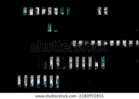 Japanese office building still operate at very late night with many office worker doing part time work. Salaryman overworking issue concept. Royalty-Free Stock Photo #2180992855