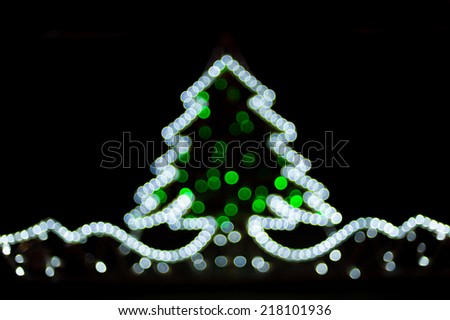 Blurred christmas tree lights on black background