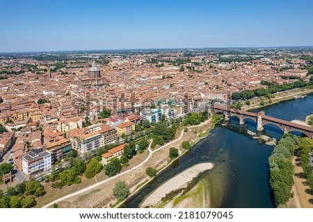 Aerial view of Pavia and the Ticino River, View of the Cathedral of Pavia, Covered Bridge. Lombardia, Italy Royalty-Free Stock Photo #2181079045