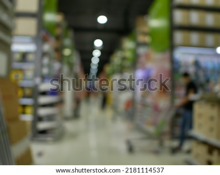 Abstract blur supermarket and shopping mall in retail sotre interior for background