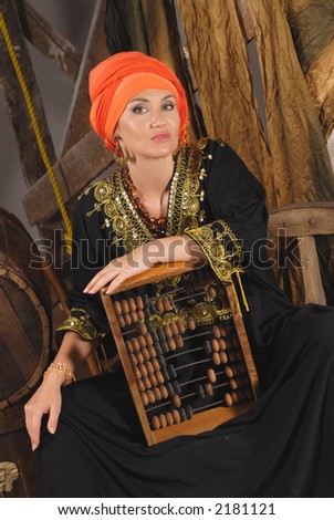 Pretty woman with old-fashioned abacus