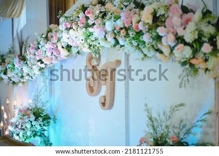 Photo wedding backdrop decoration with flowers, beautiful and aesthetic lights. Side view.