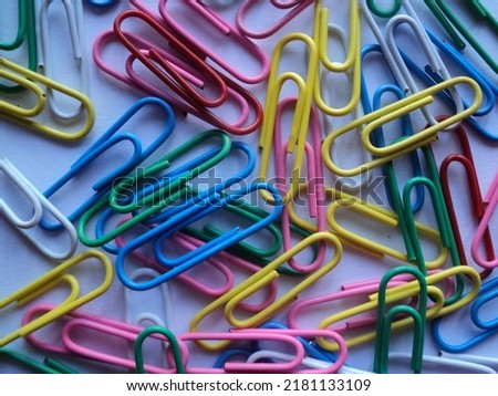 Attractive paper clip and pin wallpaper. This background can use for stationary, documentary, attachment, handcraft, collection, educational themes and concepts.