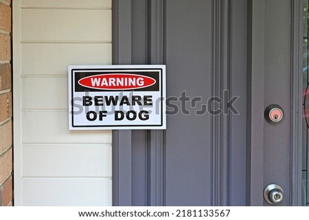 Warning beware of the dog sign on the front door Royalty-Free Stock Photo #2181133567