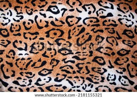 The Tiger blanket background. Matter bedspread tiger coloring texture. Tiger color soft fabric.