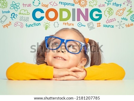 Beautiful cute little girl with eyeglasses looking at colorful CODING word, symbols and commands above her head. Kid programmer learn coding. Programming languages concept.  