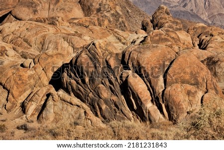 Alabama Hills are a popular filming location for television and movie productions, an archetypical "rugged" environment, rounded rocks and  destination for outdoor enthusiasts - rock climbers, photos