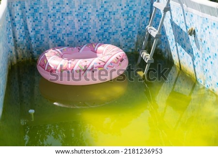 a very dirty pool in the garden Royalty-Free Stock Photo #2181236953