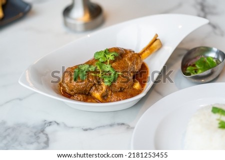 Massaman lamp Curry with streamed rice Royalty-Free Stock Photo #2181253455