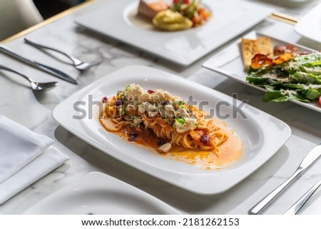 linguine pasta with crab meat with tomato sauce Royalty-Free Stock Photo #2181262153